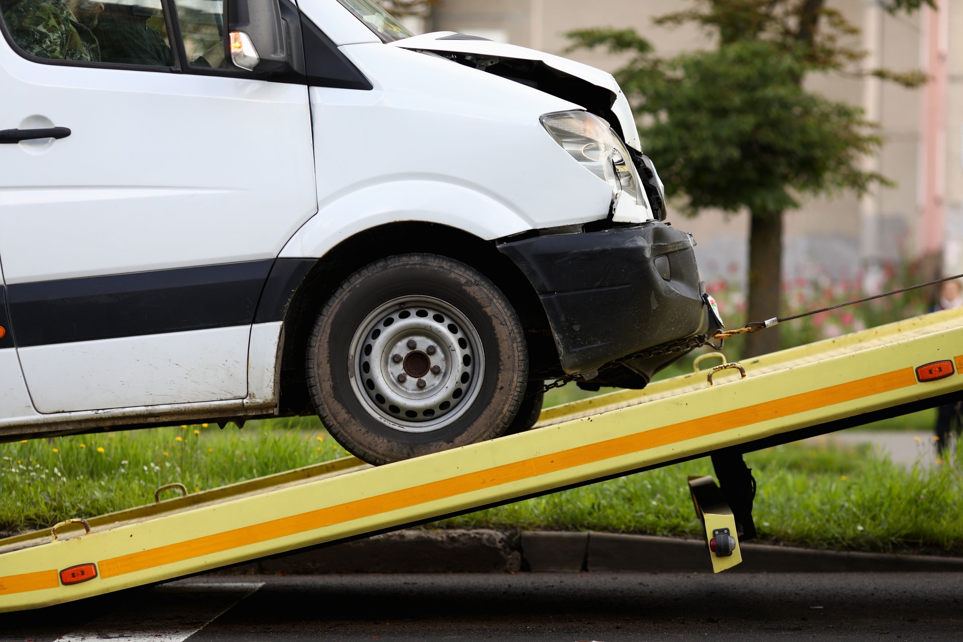 Crashed car is immersed in tow truck closeup